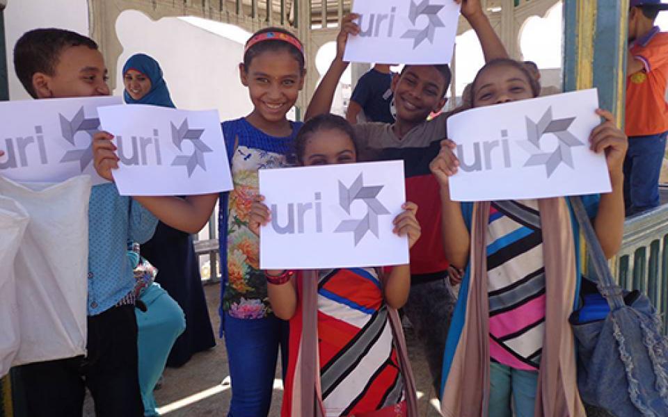 children holding the uri poster 