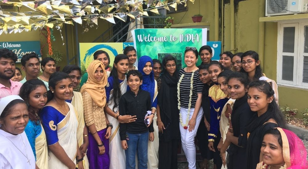 Members of Zero Limits greet Isabelle Ortega-Lockwood, URI Director of Global Communications and Strategic Planning