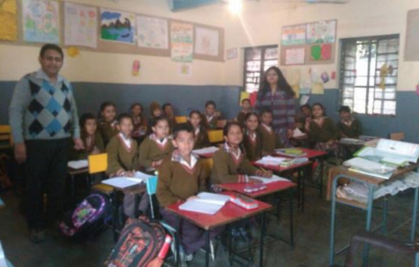 URI North India - Schoolchildren receive desks