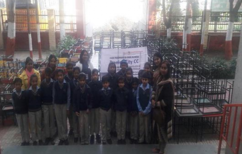 URI North India - Schoolchildren receive desks