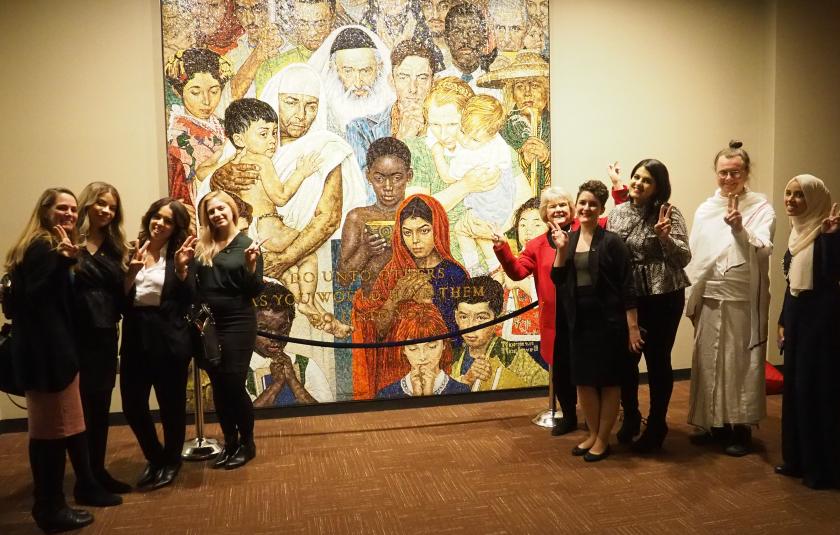 URI leaders with a mosaic of the Normal Rockwell "Golden Rule" painting at the UN. 