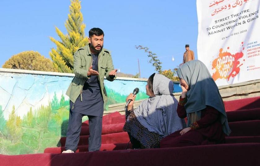 Photo: Two people performing on stage