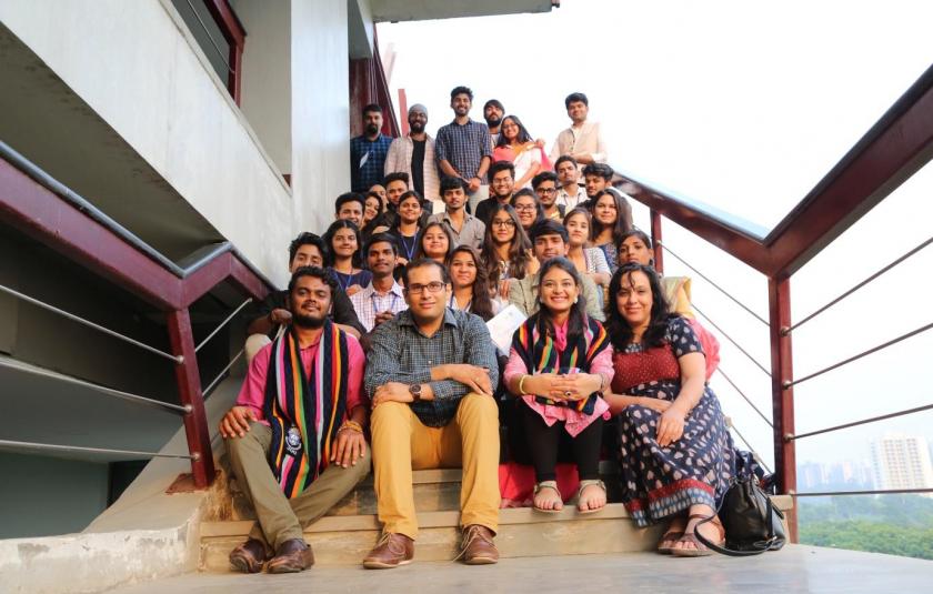 Photo: A group of people sitting on the stairs