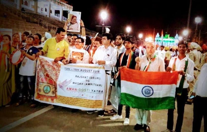 Photo: A group of people holding a banner and the Indian flag
