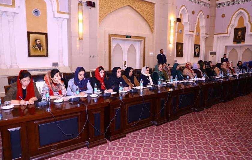 A group of women sitting in a conference.