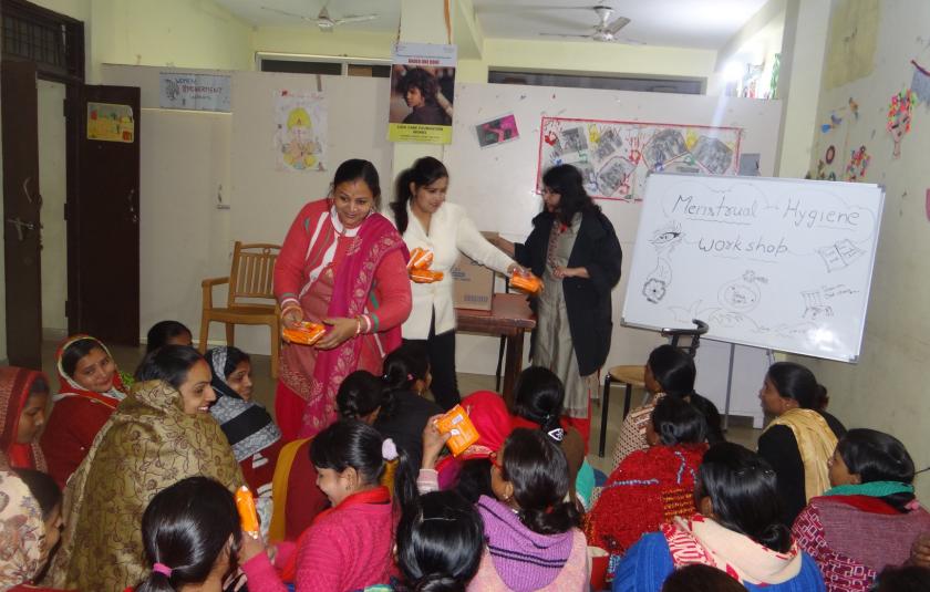 A group of women receiving training in a room.