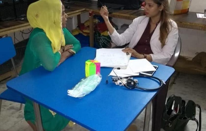 A woman gets checked up by a doctor.