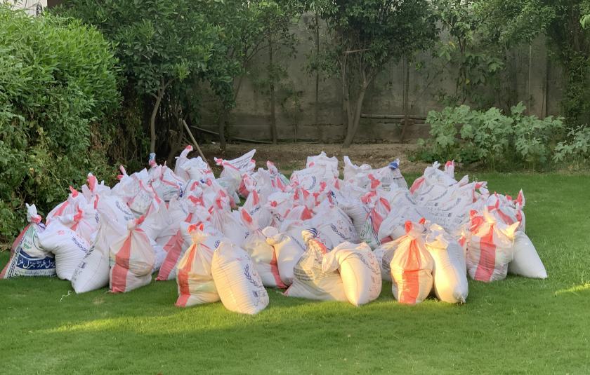 Photo: image of bags of donations gathered and distributed by URI members during the COVID-19 pandemic.