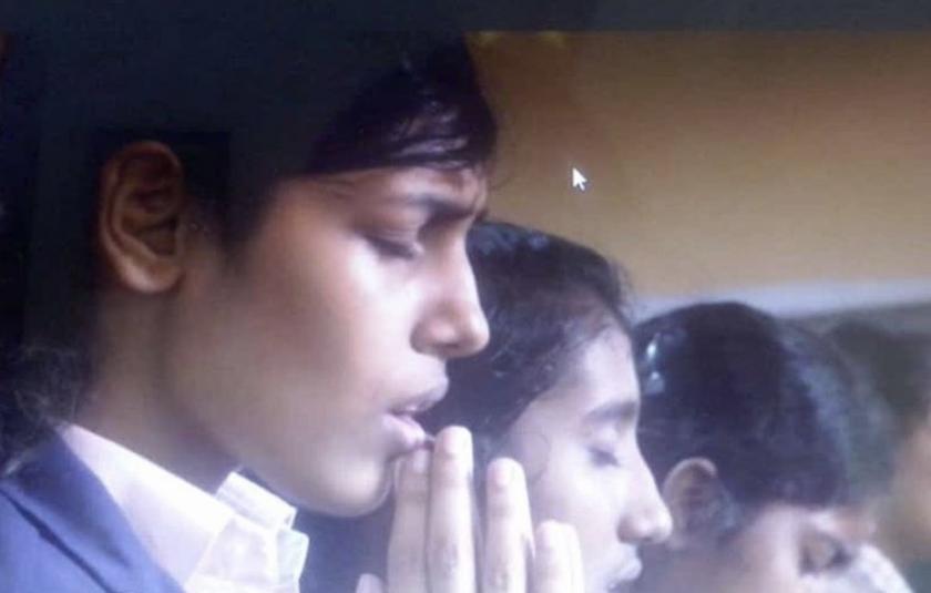 Photo: A girl praying 