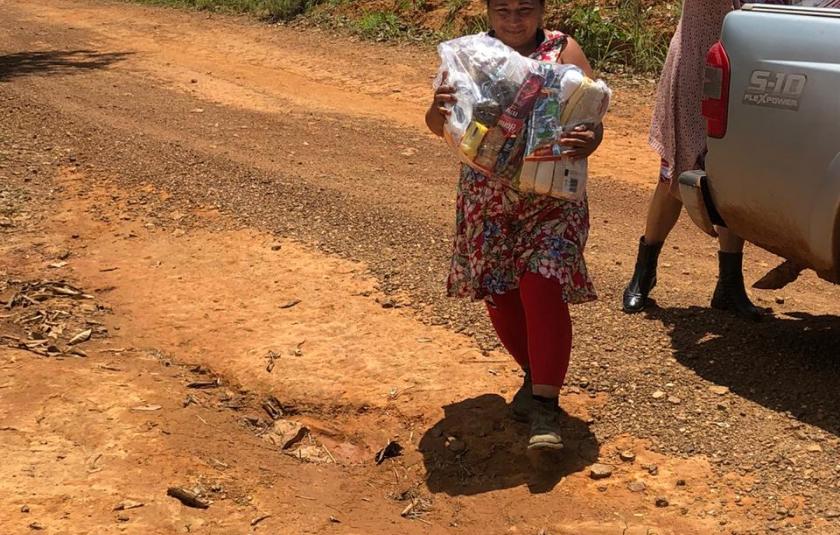 Photo: Woman receiving the food basket 