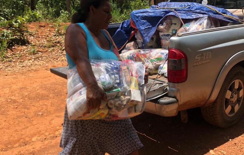 Photo: Woman receiving the food basket 