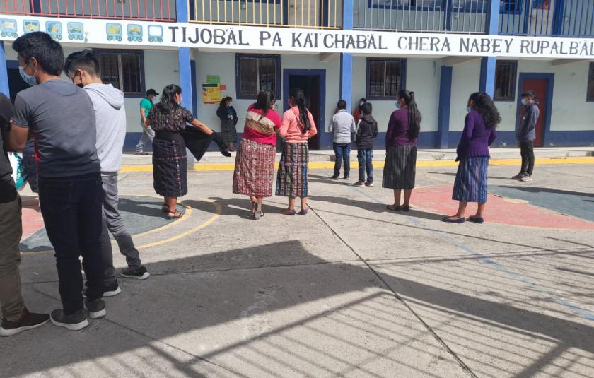 Photo: People in front of the school