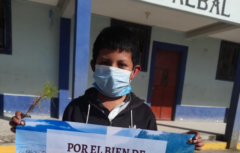 Photo: Child holding banner 