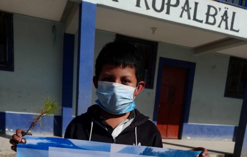 Photo: child holding banner 