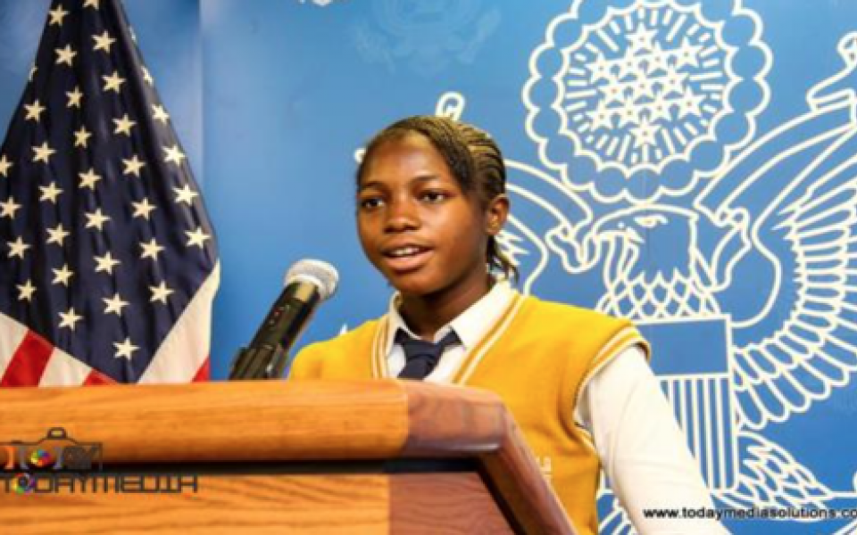 young women speaking at the podium
