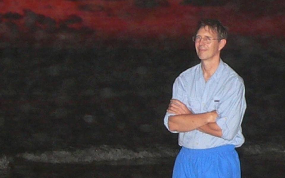 charles standing in a beach