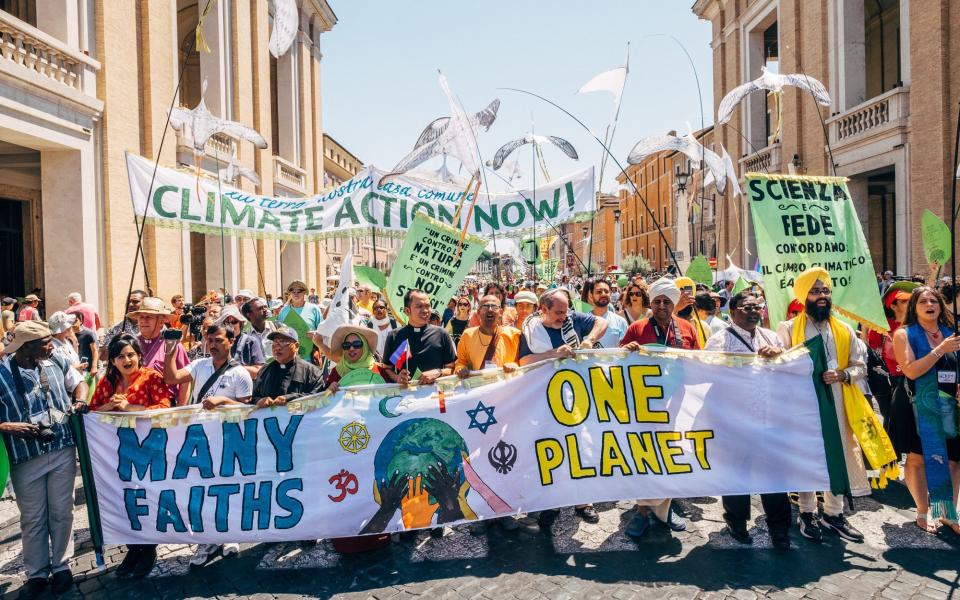 Reps from many faiths march for one planet in Rome