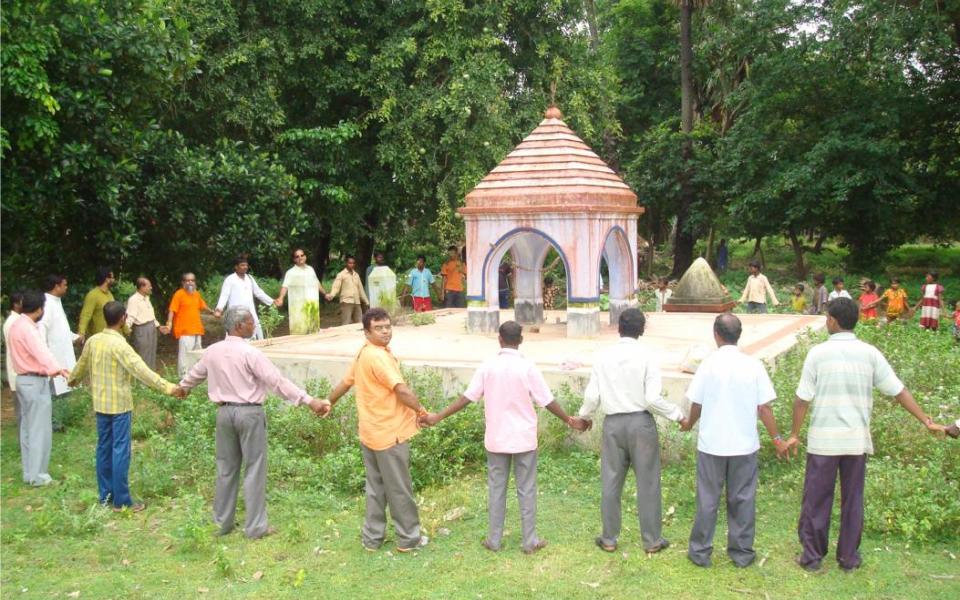 people holding hands in a circle