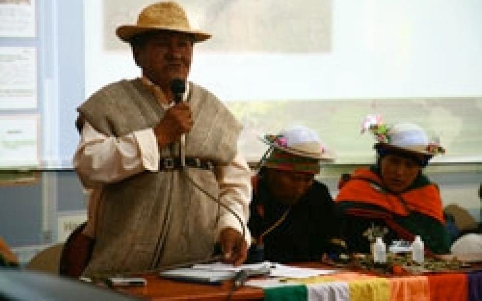 A Man is speaking using a microphone
