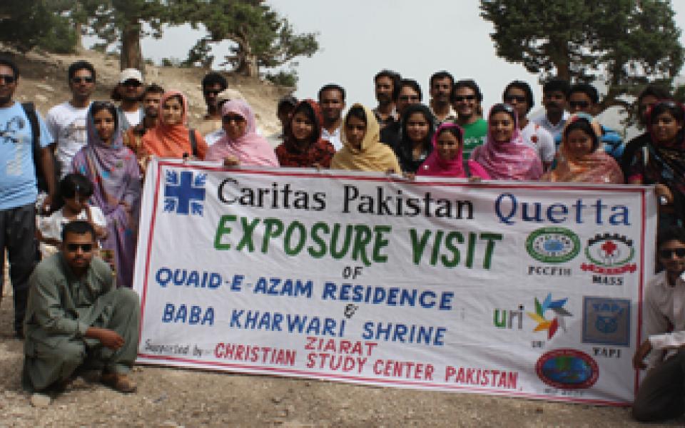 group holding poster