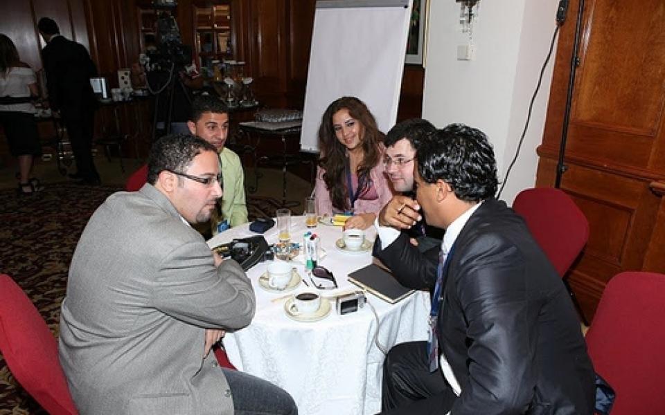 group of young people talking to each other