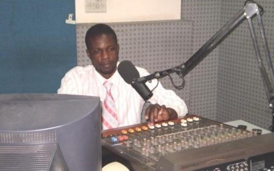 A man playing with a radio