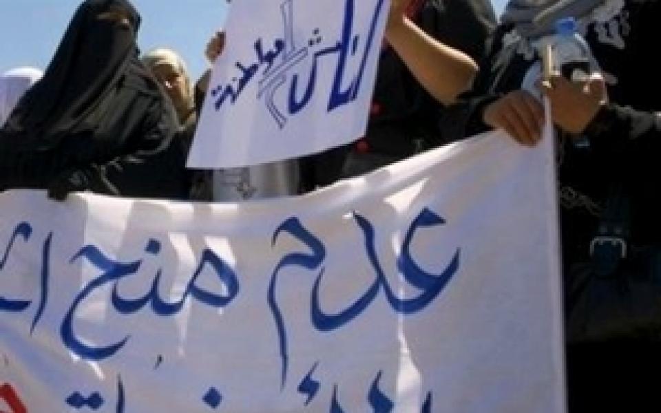 women holding protesting posters
