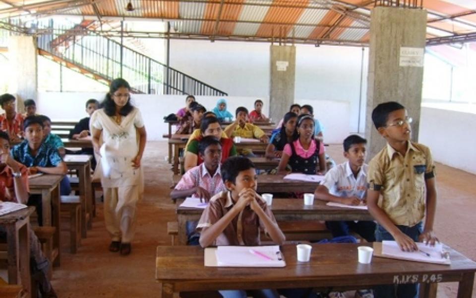 students participating in a class room discussion