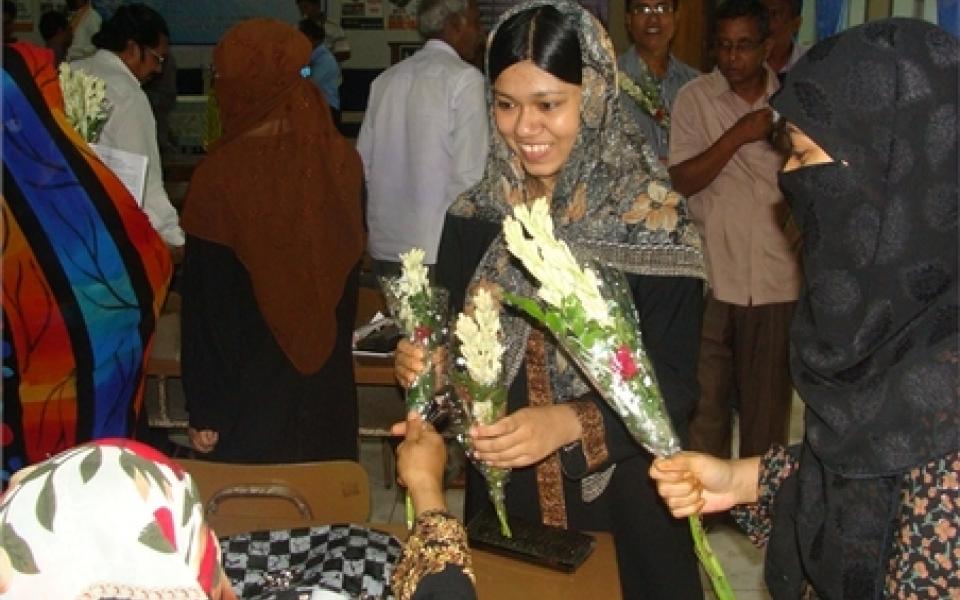 women holding on flowers 