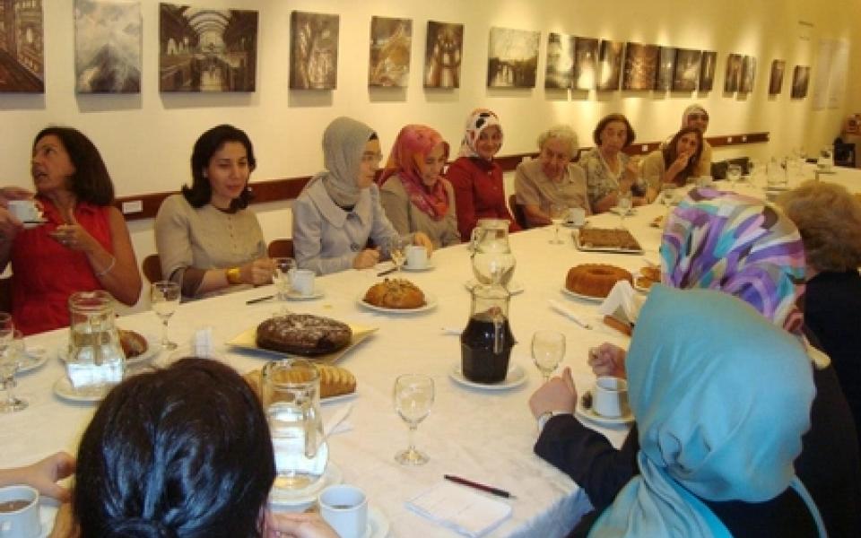 women sharing food in a lunch-time 