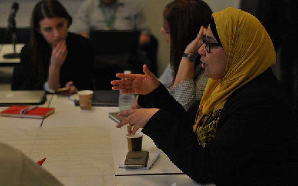 A Muslim woman speaking in discussion