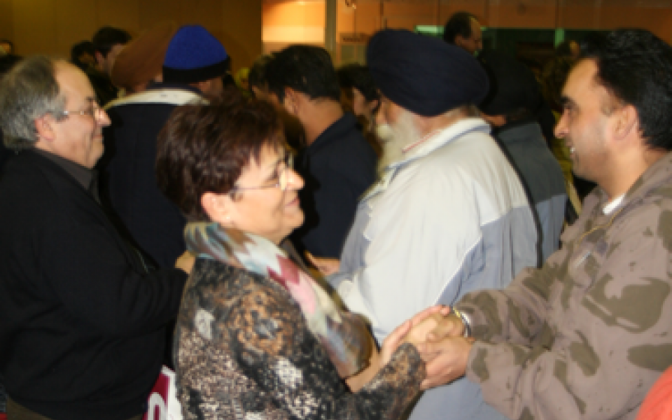a man is shaking hands with an adult women