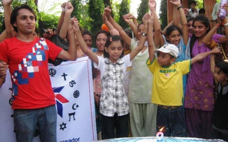 youth are holding their hands up together
