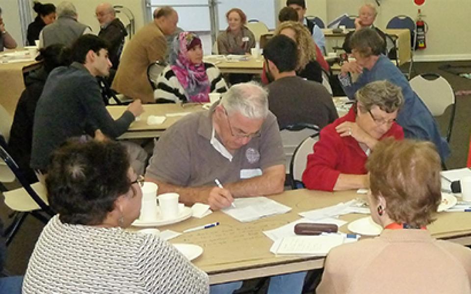 men writing in a table 