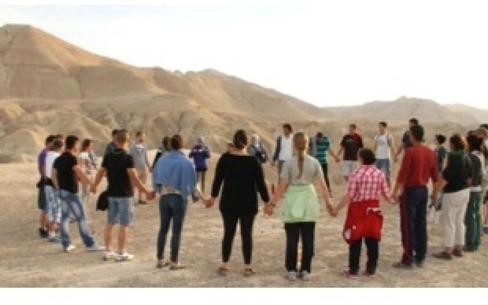youth holding hands in circle