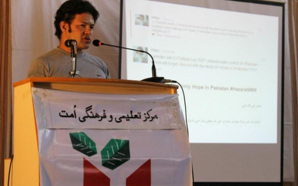 irfan is speaking at the podium