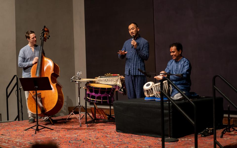 Photo: Three Musicians Playing Music on a Stage 