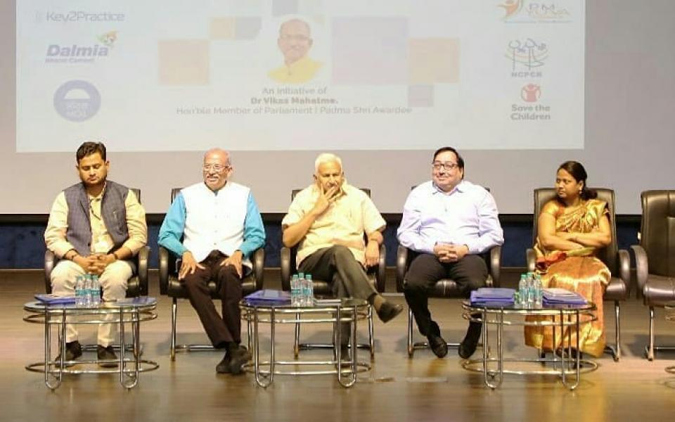 A group of people sitting on a dais.