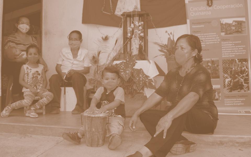 Photo: People from te Quinaroa CC celebrating the Virgin Mary day set on the floor. 