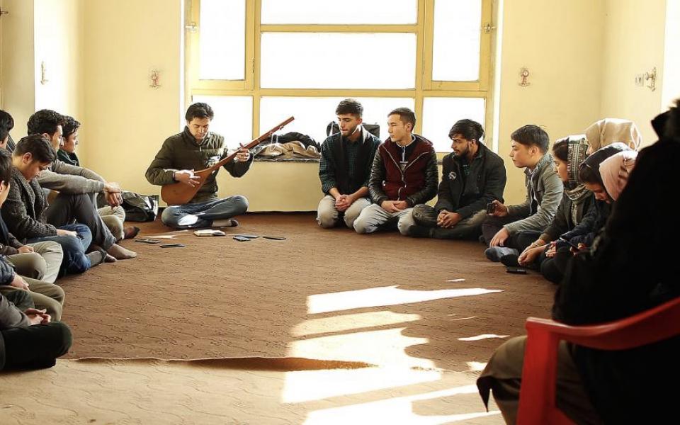 Photo: A group of people sitting in a circle