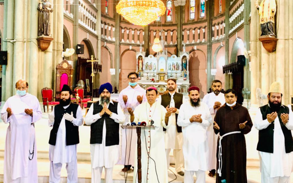 Photo: depicting a group of religious leaders gathering for a day of prayer and fasting and Pakistan