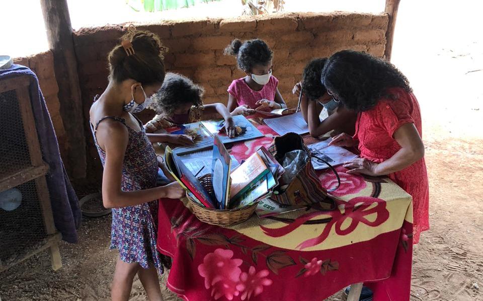 Phot: Teacher Maria Oliva teaching the kids at a very simple environment on the children house 