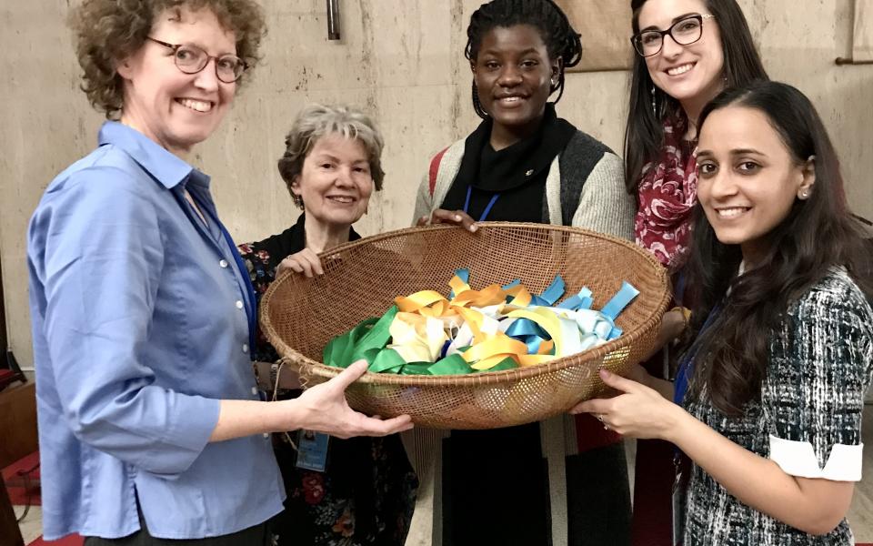 Kendra (second from right) participates in a ceremony at the UN Chapel.