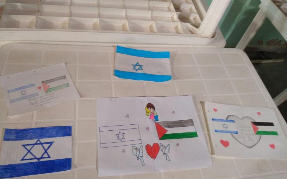 Photo: Draw with different flags like Palestinian and Jewish. 