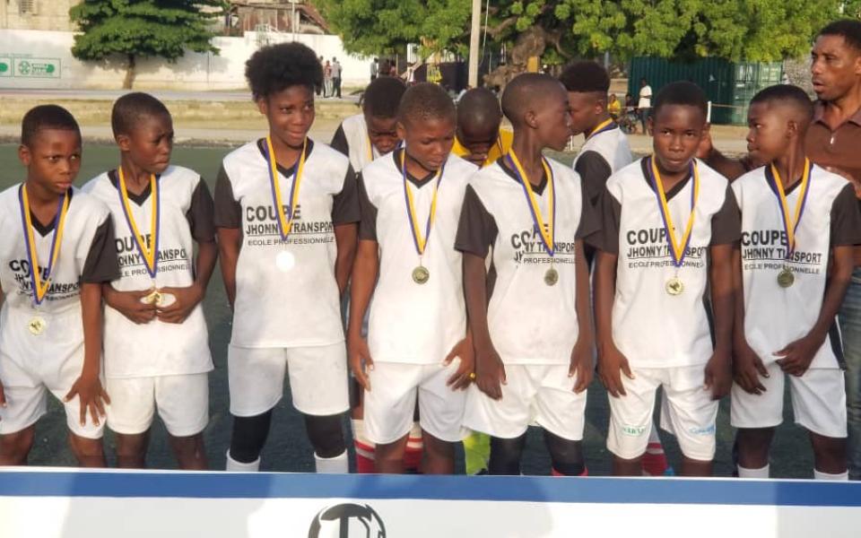 Photo: Children of the soccer time posing for the photo.