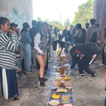 Photo: Members of the CC and the university students sharing food.