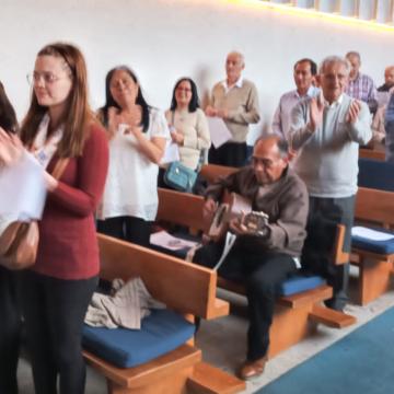 Photo:  Diferente members of various religions united in a Christian church.