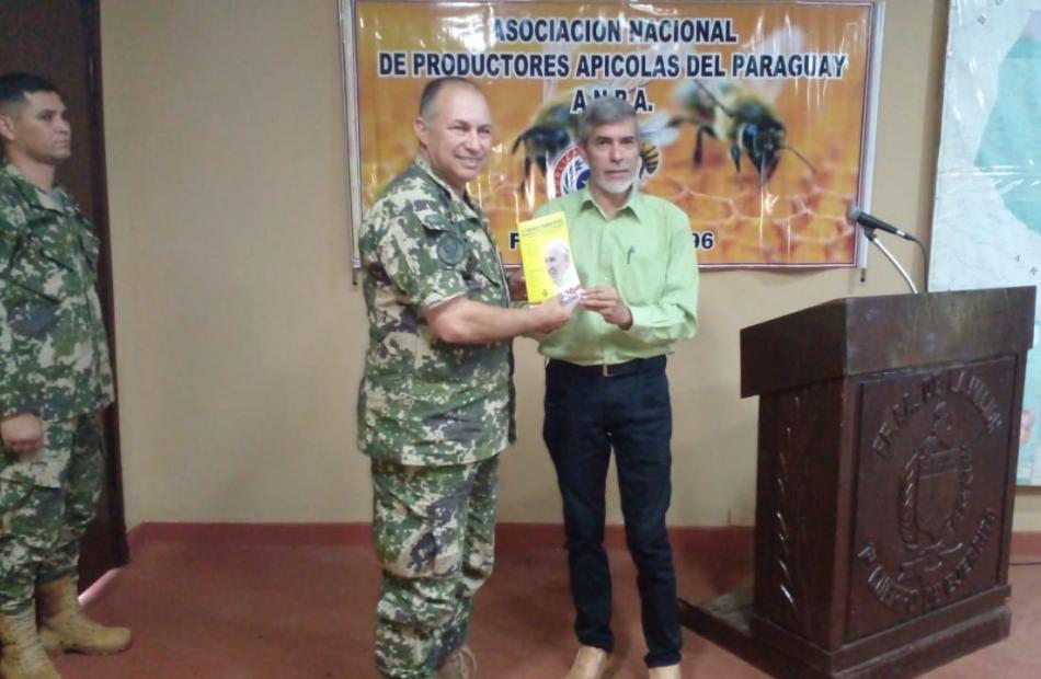 Photo: Member of the CC  National Network of Agrarian Educators of Paraguay receiving certification. 